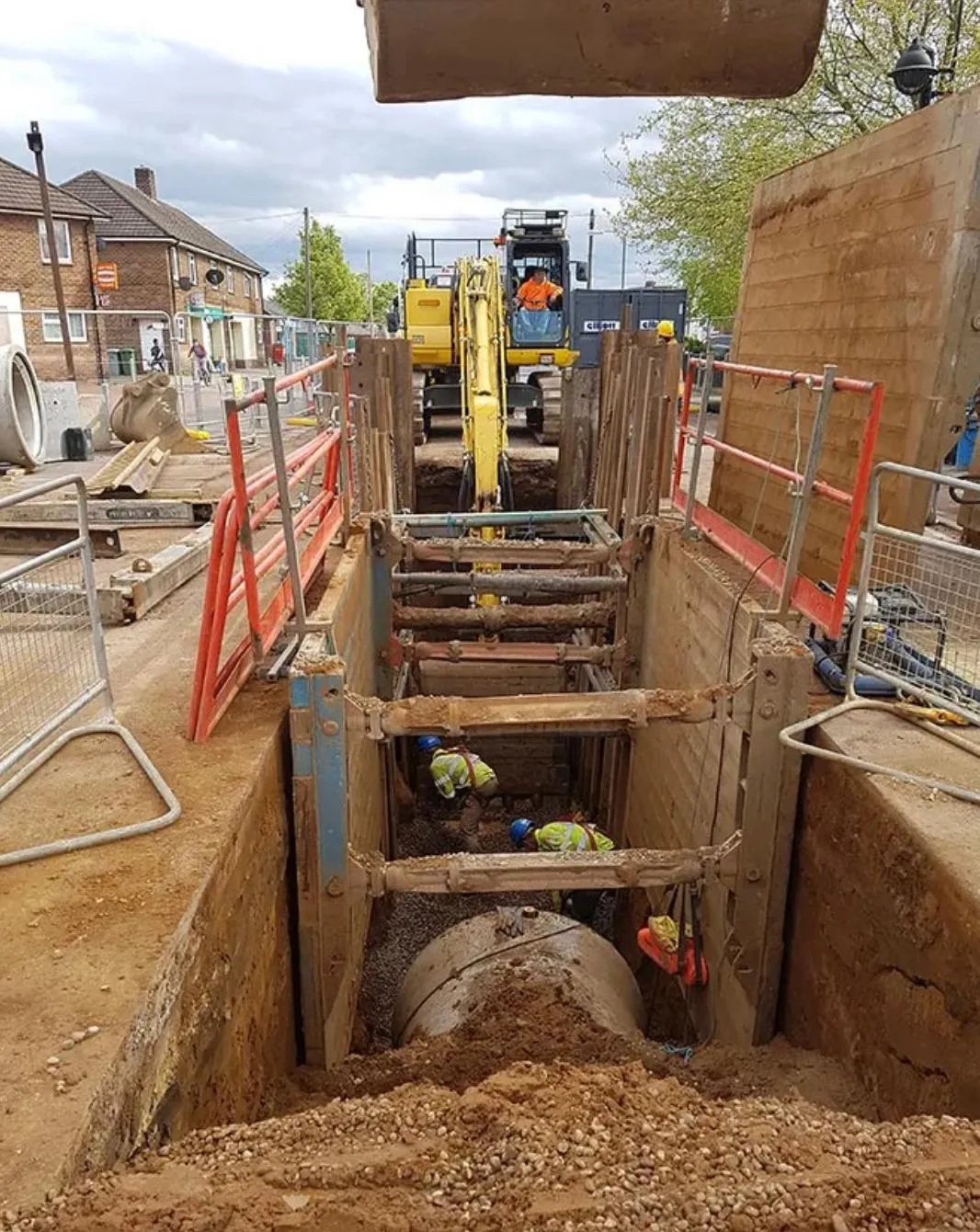 A construction site with a large pipe in the middle of it.